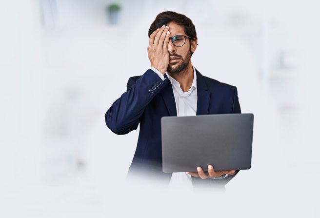 Tired man with laptop